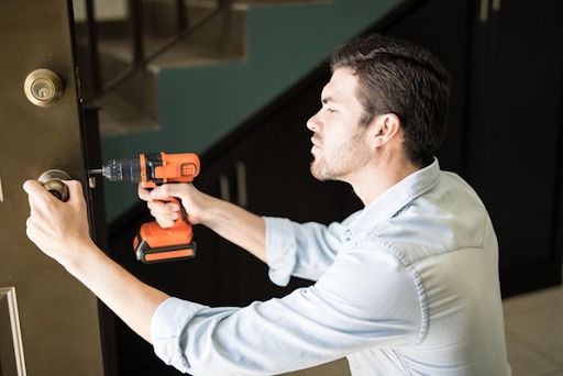 a locksmith providing service on a locked door