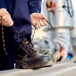 A Plumber Wearing Boots Before Going To Work