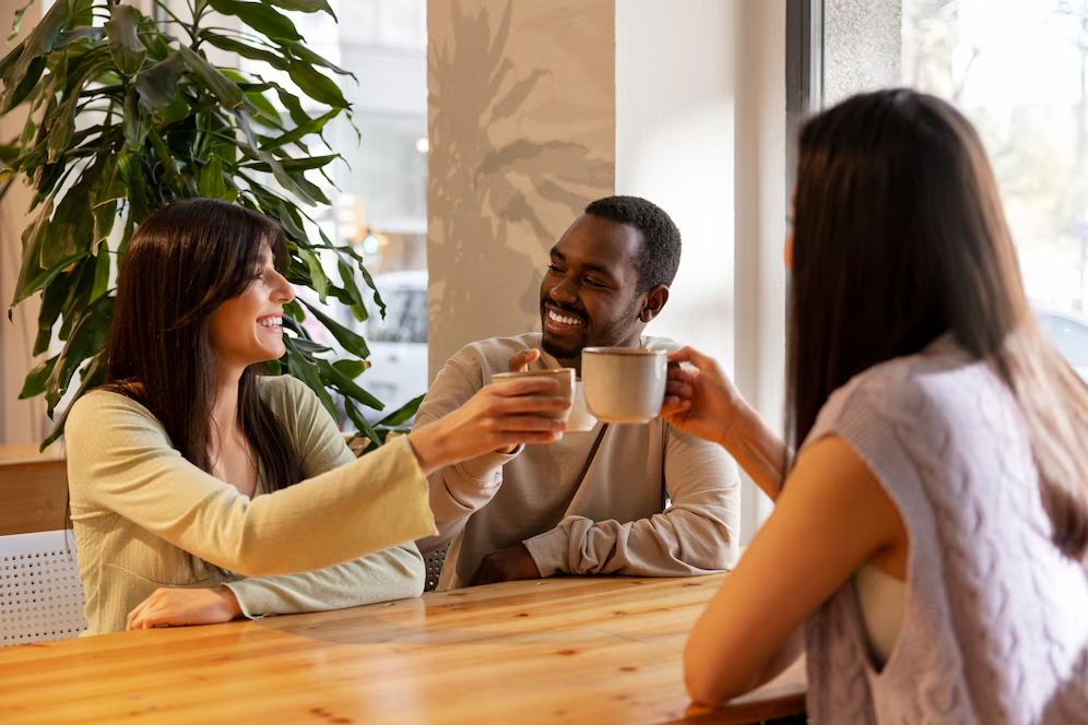 a group of people are enjoying coffee